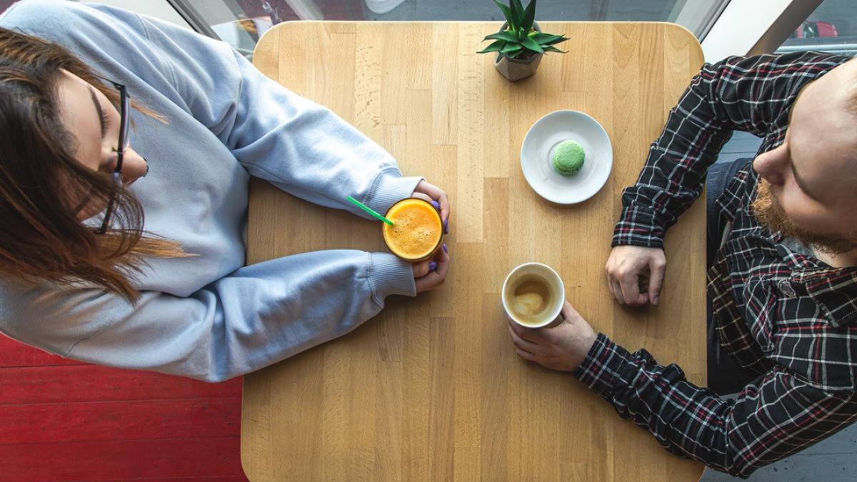 young-guy-girl-table-cafe-with-juice-coffee-top-view
